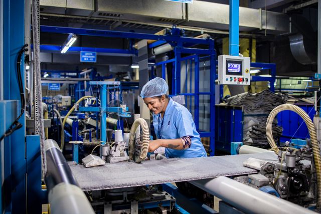 Technician working on equipment in an industrial workshop